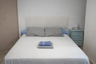 Cama o camas de una habitación en Vivienda Turística Templo Romano