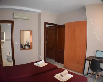 Cama o camas de una habitación en Hostal Alamare