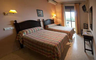Cama o camas de una habitación en Hostal San Luis