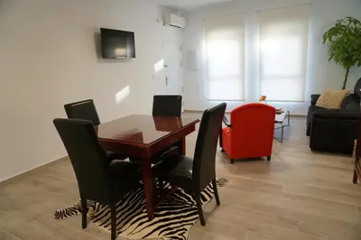 Una televisión o centro de entretenimiento en Apartamentos Ondeanos