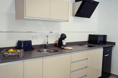 Una cocina o zona de cocina en Apartamentos Ondeanos
