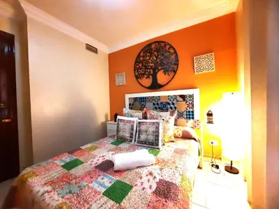 Cama o camas de una habitación en Budget and cute rooms with balcony Sevilla center