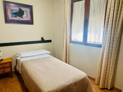 Cama o camas de una habitación en Hotel Hospederia Zacatin