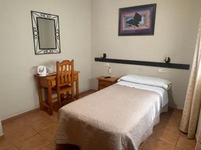 Cama o camas de una habitación en Hotel Hospederia Zacatin