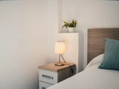 Cama o camas de una habitación en Hostal Delia
