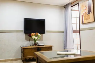 Una televisión o centro de entretenimiento en Geysotur Porta Novas Home