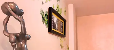 Una televisión o centro de entretenimiento en VENUS DE BAEZA SUITE
