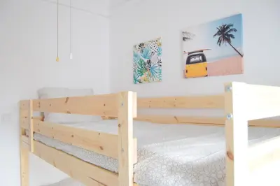 Cama o camas de una habitación en Enjoy Sevilla Familia