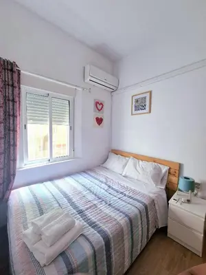 Cama o camas de una habitación en Enjoy Sevilla Familia