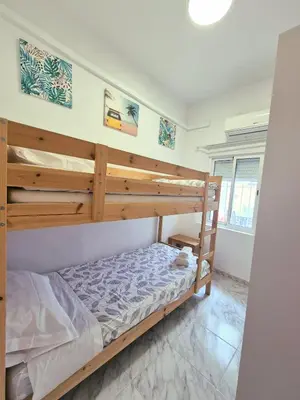 Cama o camas de una habitación en Enjoy Sevilla Familia