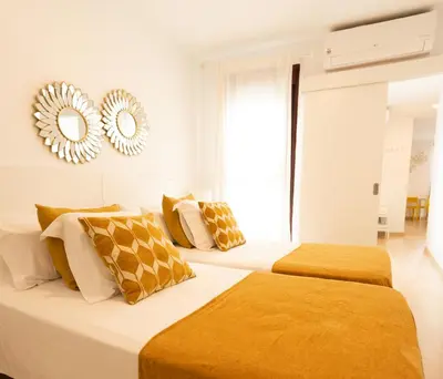 Cama o camas de una habitación en GoToSeville ALTAIR SUITES