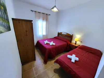 Cama o camas de una habitación en casa rural el olimpo-caminito del rey