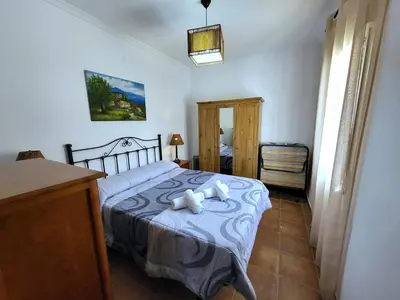 Cama o camas de una habitación en casa rural el olimpo-caminito del rey