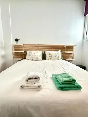 Cama o camas de una habitación en Hispalis Puerta Carmona