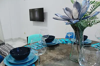 Una televisión o centro de entretenimiento en WISH SUITE SAN LUIS DE SEVILLA