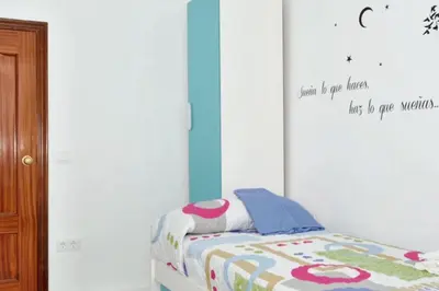 Cama o camas de una habitación en Charming city centre apartment in Córdoba with parking