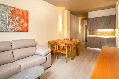 Zona de estar de Apartamentos Sevilla Este by QHotels