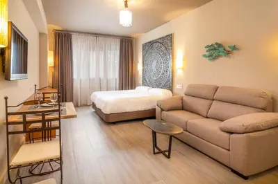 Zona de estar de Apartamentos Sevilla Este by QHotels