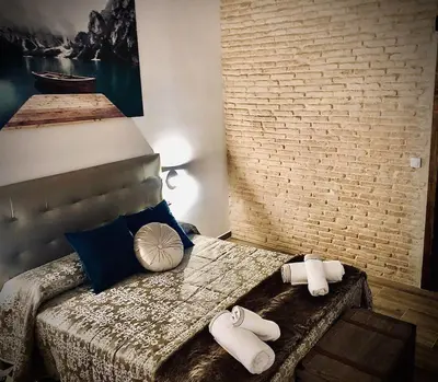 Cama o camas de una habitación en Dúplex el Espejo de la Mezquita