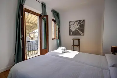 Cama o camas de una habitación en Apartamentos Setas Center