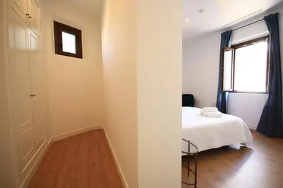 Cama o camas de una habitación en Apartamentos Setas Center