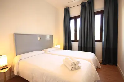 Cama o camas de una habitación en Apartamentos Setas Center