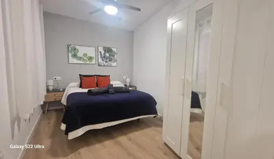 Cama o camas de una habitación en San Pedro Parking Gratis Coche Mediano