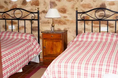 Cama o camas de una habitación en Vivienda Turística Alojamiento Rural EL Trillo