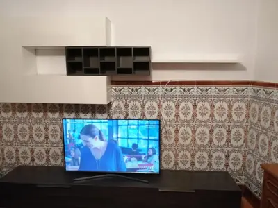 Una televisión o centro de entretenimiento en Casa Rural Guzman