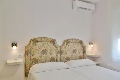 Cama o camas de una habitación en SunShine Buen Pastor