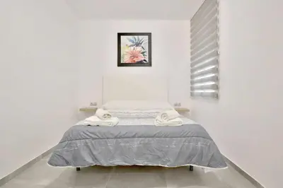 Cama o camas de una habitación en Apartamento Paseo de La Ribera