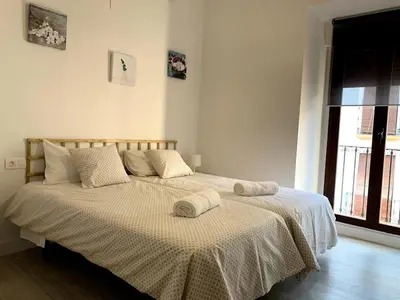 Cama o camas de una habitación en Casa Ribera LUCANO Centro Histórico