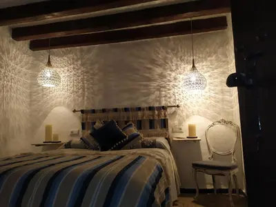 Cama o camas de una habitación en El escondite de Martina, Casa Rural Romántica
