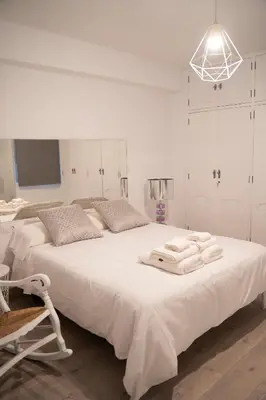 Cama o camas de una habitación en Apartamento turístico Calle San Basilio 6 patios