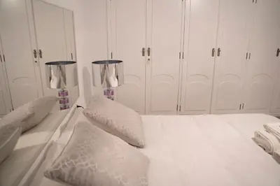 Cama o camas de una habitación en Apartamento turístico Calle San Basilio 6 patios