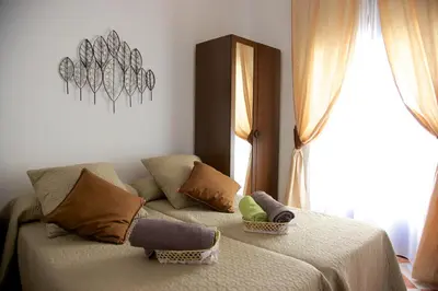 Cama o camas de una habitación en Apartamentos Plaza de Austria