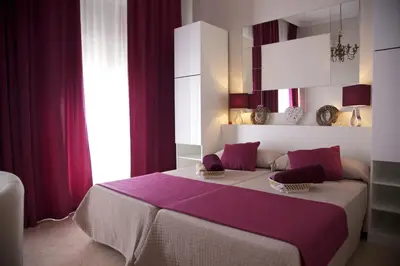 Cama o camas de una habitación en Apartamentos Plaza de Austria