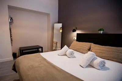 Cama o camas de una habitación en Apartamentos Doña Concha