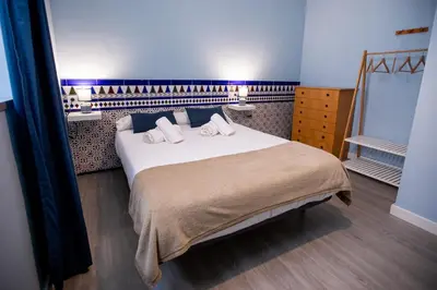 Cama o camas de una habitación en Apartamentos Doña Concha