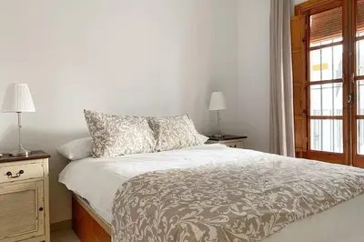 Cama o camas de una habitación en Historia y Tradición - Sevilla desde dentro.