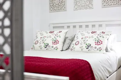 Cama o camas de una habitación en Alohamundi Cruz Verde