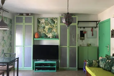 Una televisión o centro de entretenimiento en One bedroom penthouse