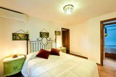 Cama o camas de una habitación en Vivienda Turística La Huerta