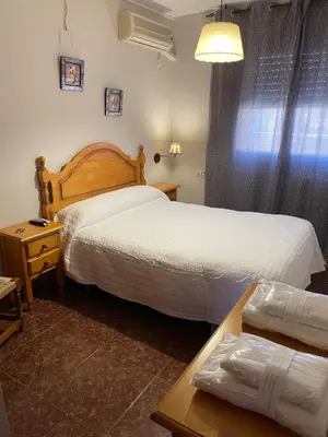 Cama o camas de una habitación en Hostal Parapanda