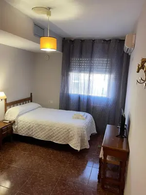 Cama o camas de una habitación en Hostal Parapanda