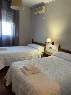 Cama o camas de una habitación en Hostal Parapanda