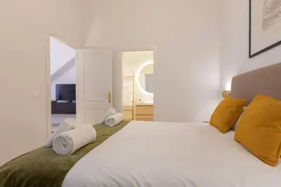 Cama o camas de una habitación en MuMu Luxury Suite Lirio