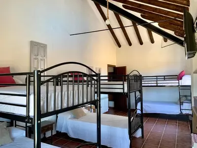 Cama o camas de una habitación en Los Palomos casa rural en el centro de Andalucía