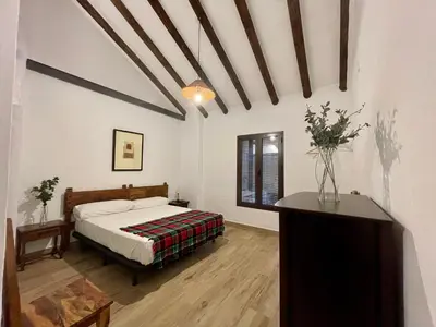 Cama o camas de una habitación en Los Palomos casa rural en el centro de Andalucía