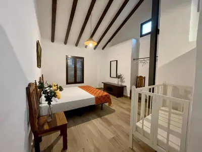 Cama o camas de una habitación en Los Palomos casa rural en el centro de Andalucía